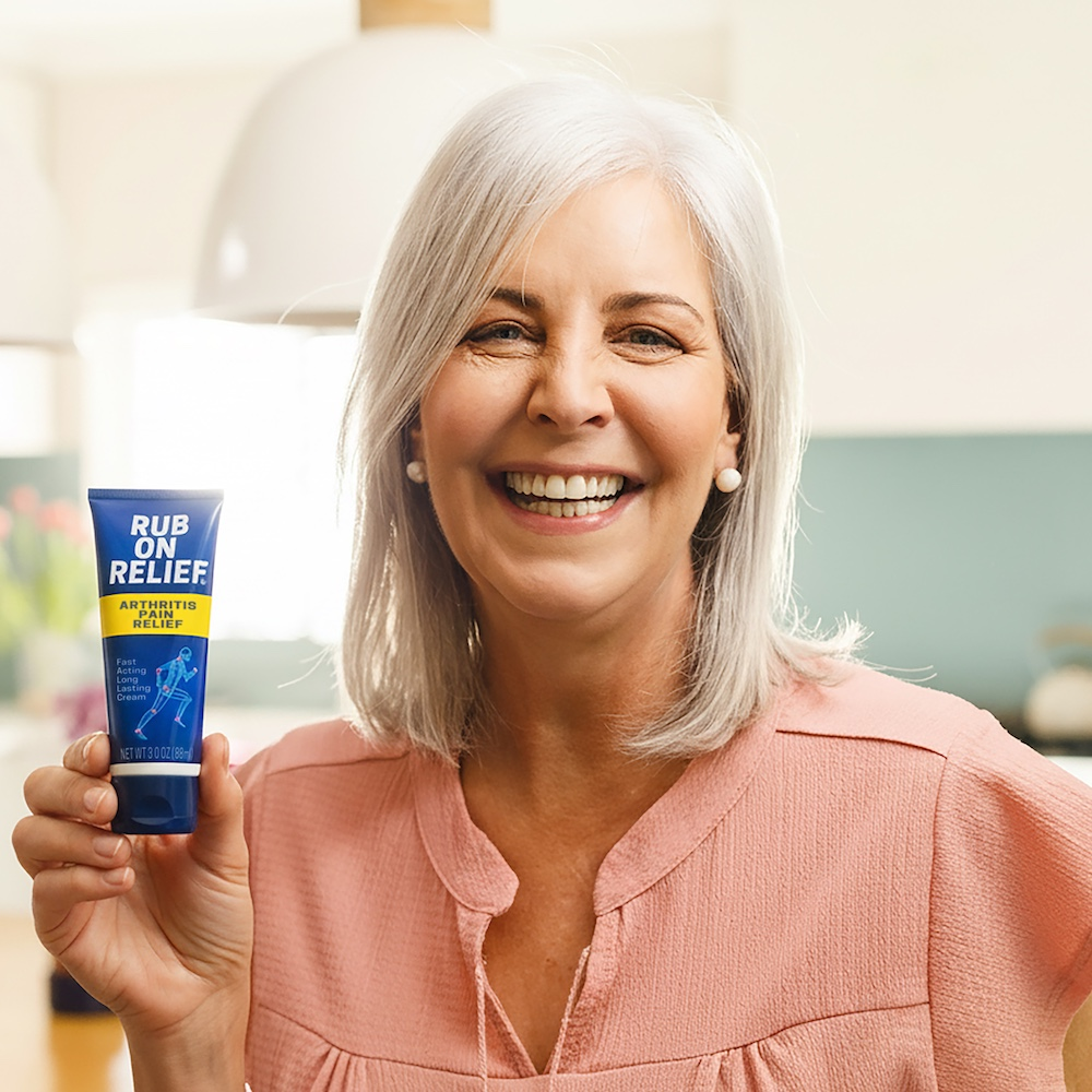 Customer holding LivingWell Rub On Relief